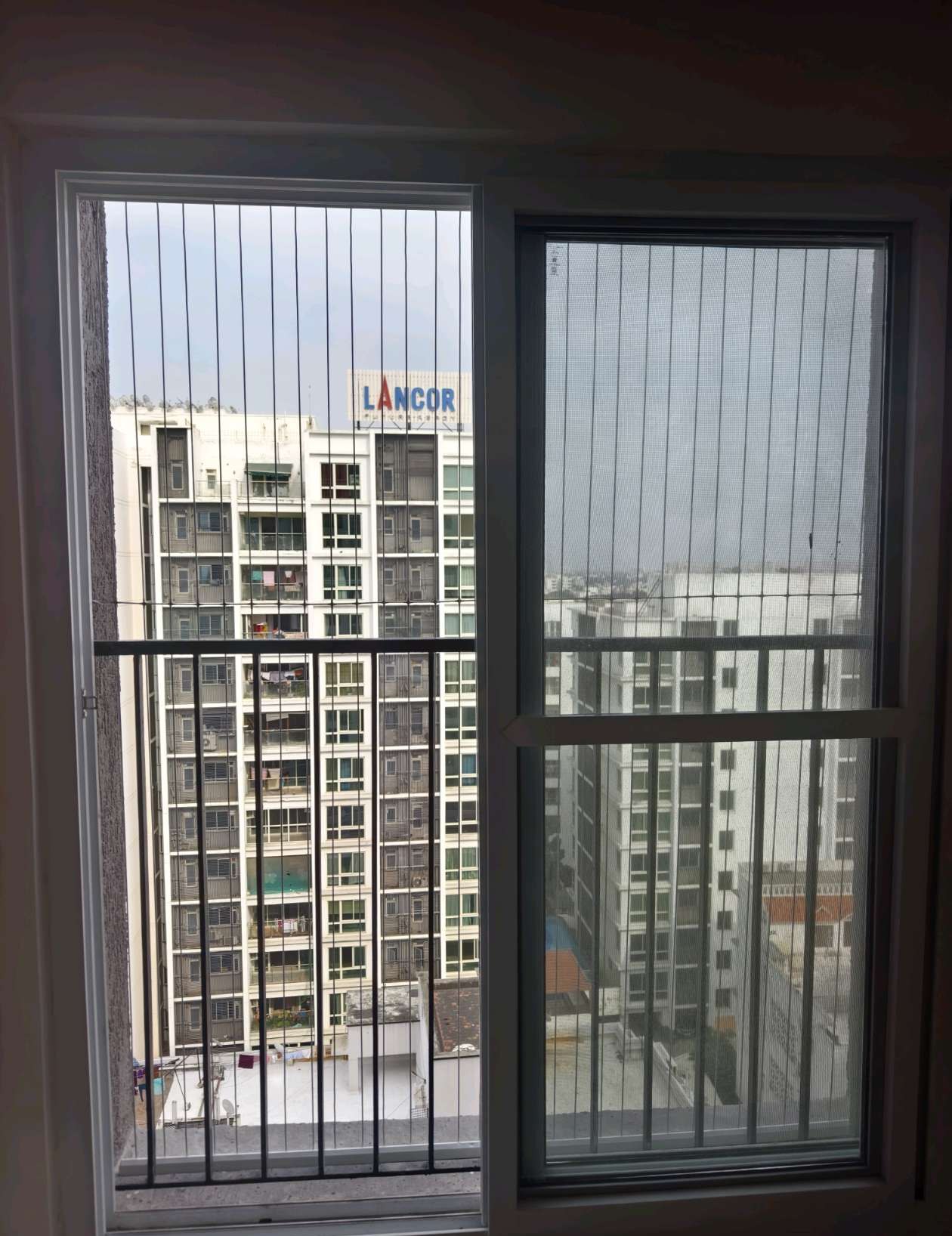 Balcony doorway and city-facing grill cables — real YPL work shown for Paranur customers