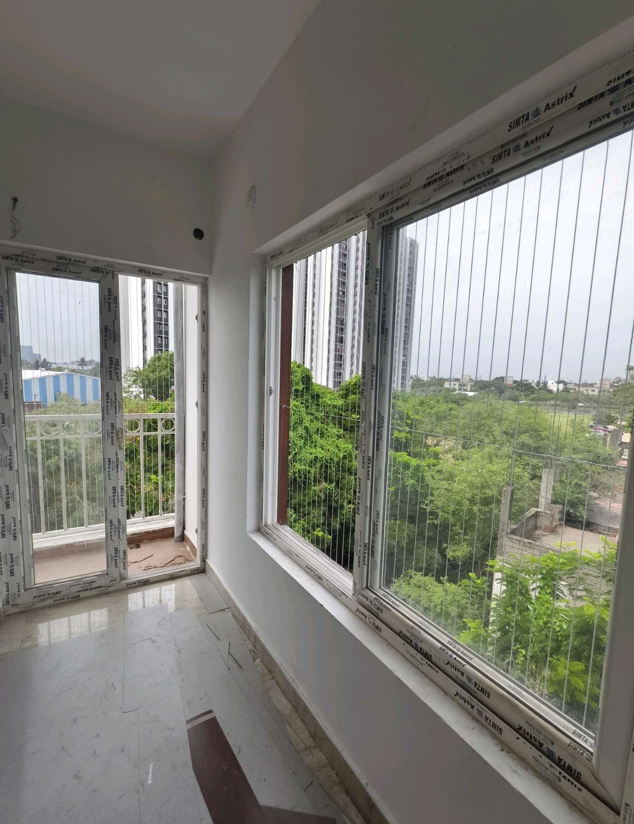 Sunlit corner room with windows and vertical cables — real YPL work shown for Athipet customers