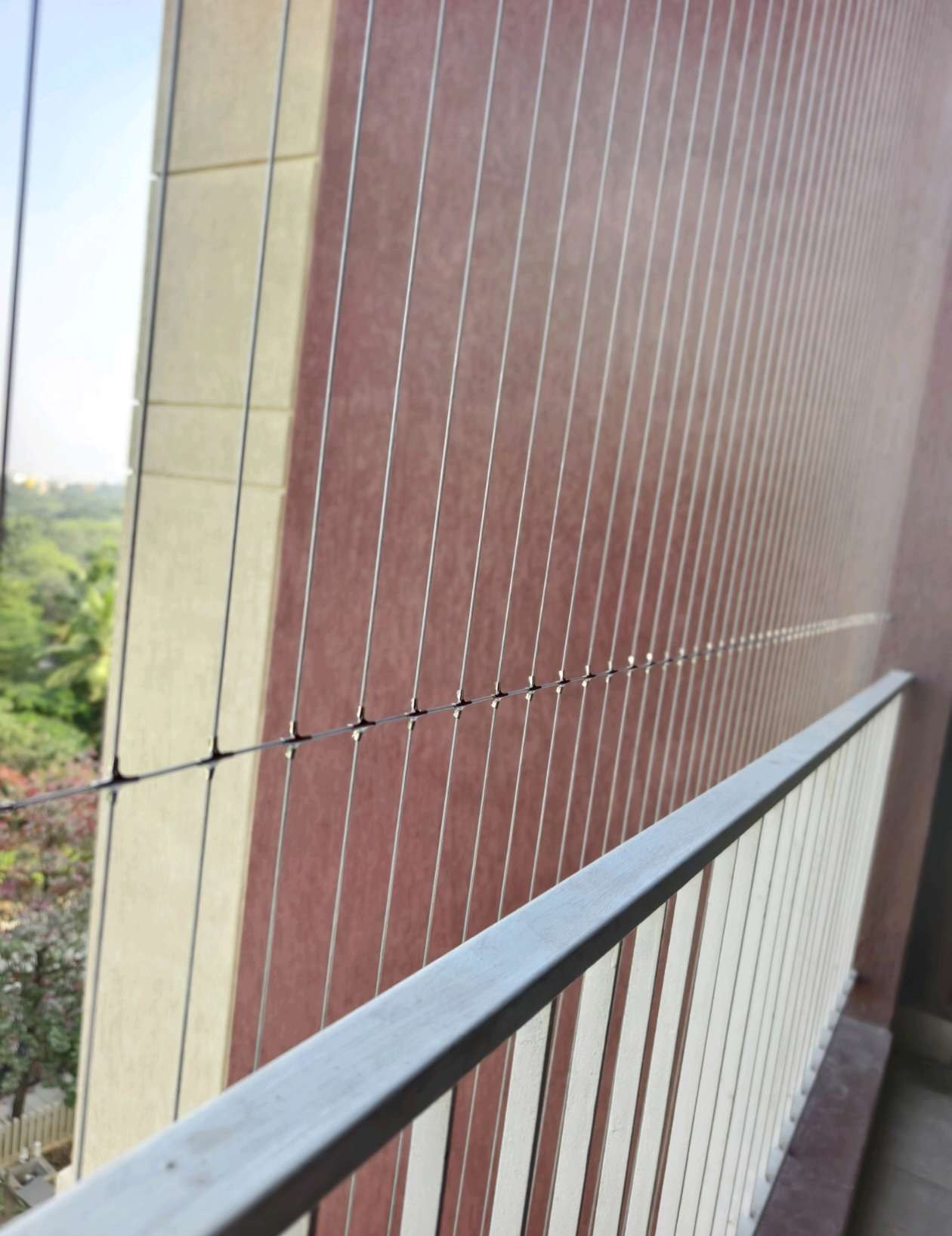 Long balcony with railing and vertical cables — real YPL work shown for Alapakkam customers