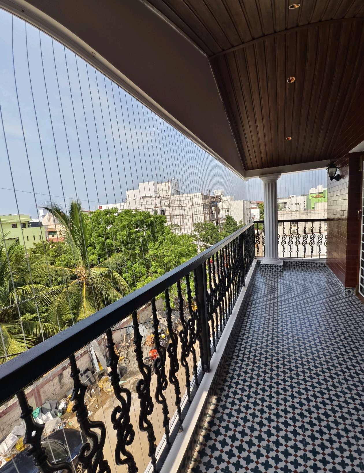 Long tiled balcony with railing and fine cables — real YPL work shown for Avadi customers