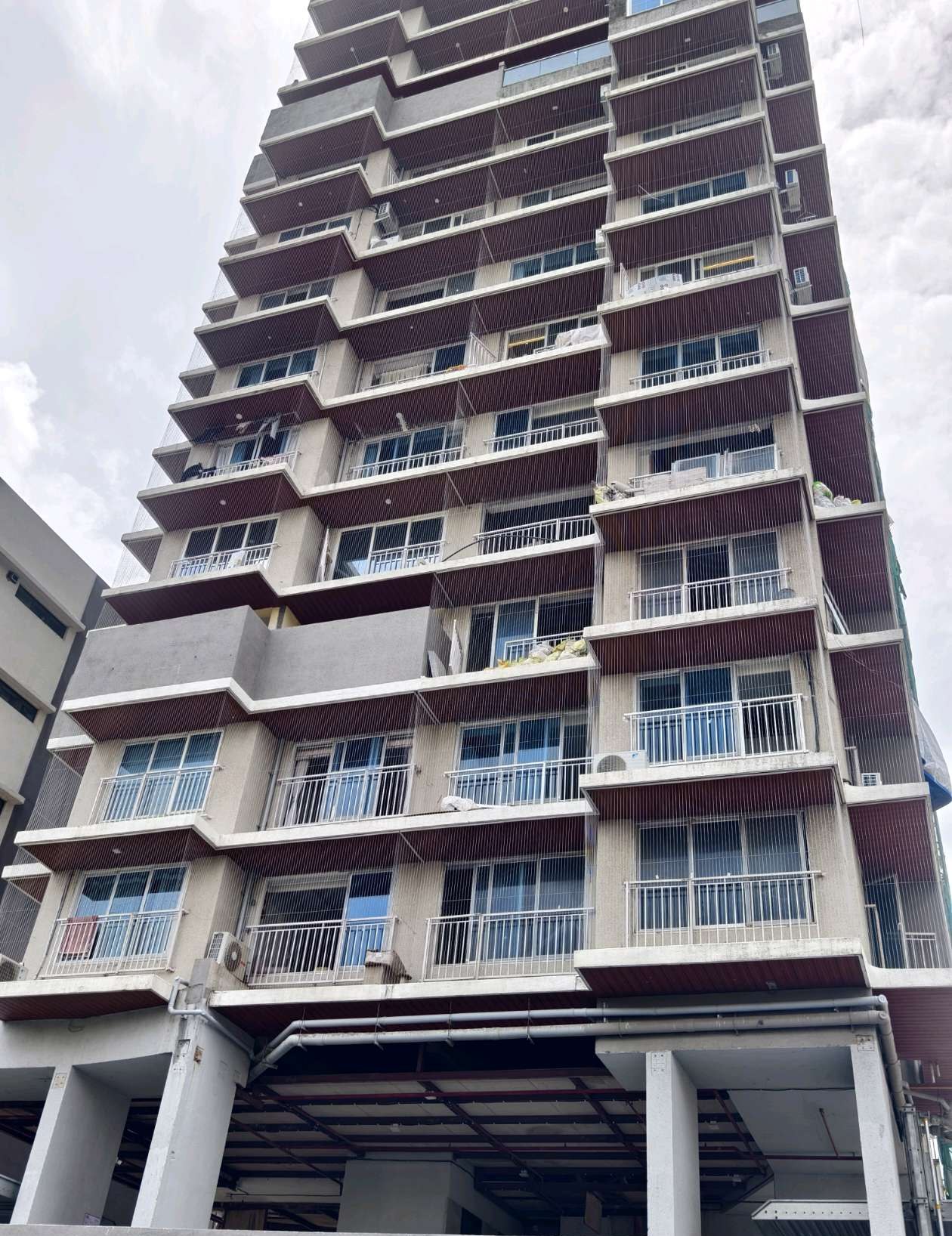 Multi-storey curved balcony building exterior — real YPL work shown for Ayanavaram customers