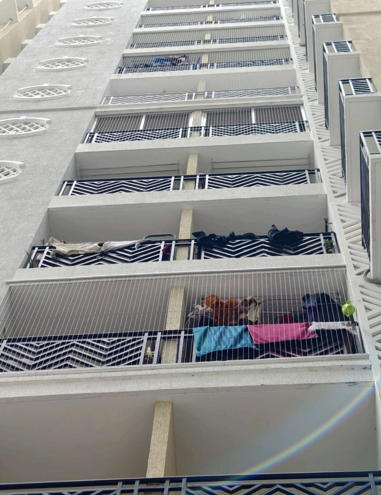 Apartment facade showing protected balcony openings — real YPL work shown for Cheyyur customers