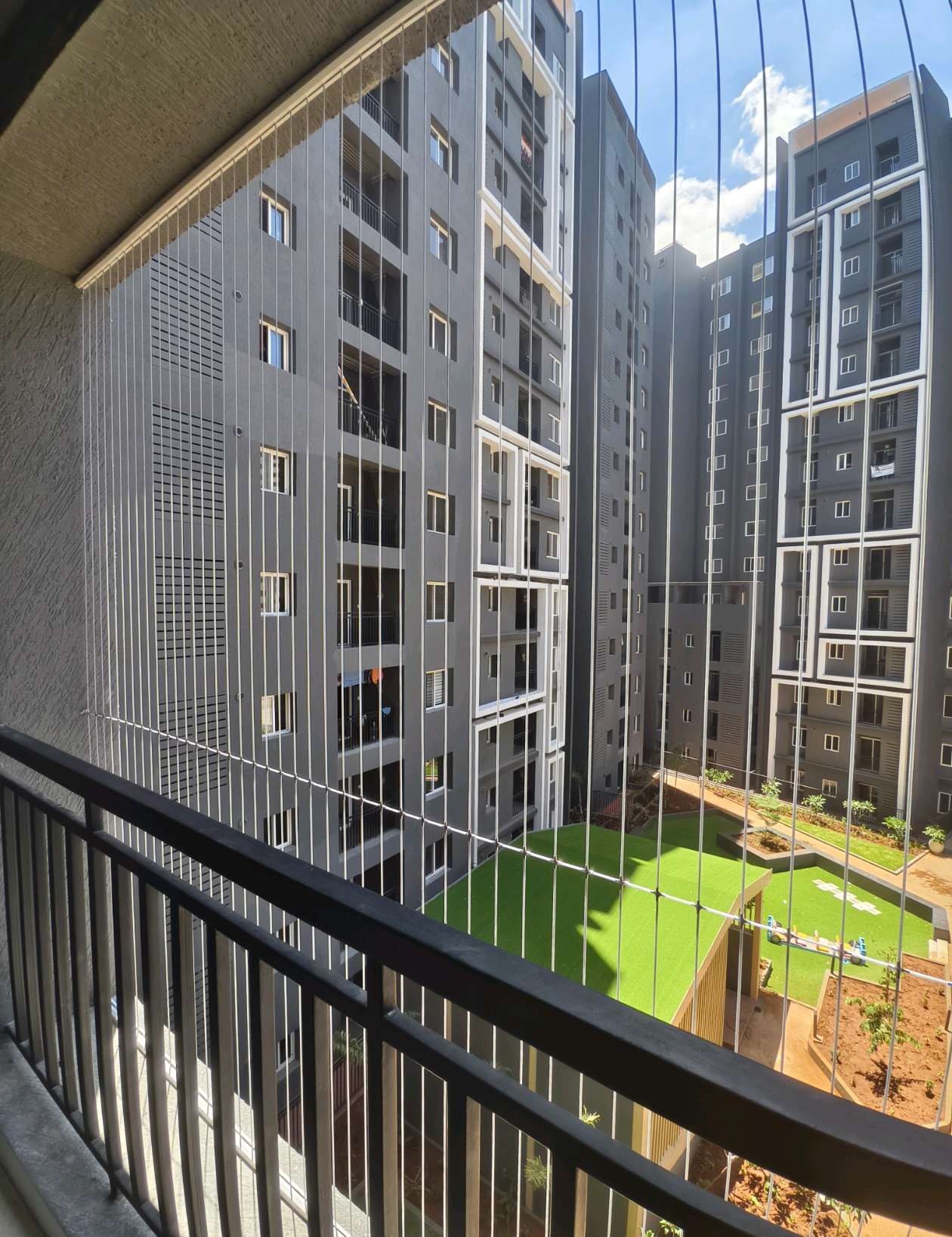Apartment balcony railing overlooking neighboring towers — real YPL work shown for Chitlapakkam customers