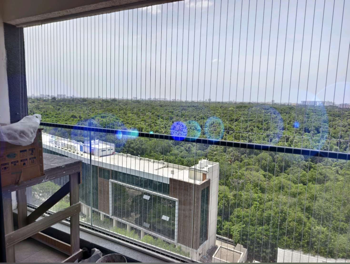Balcony railing and fine grill cables overlooking greenery — real YPL work shown for Avadi customers