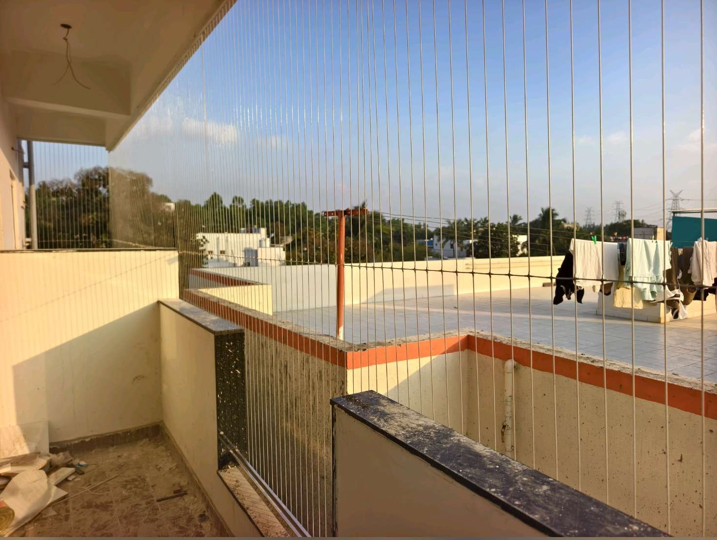 Open terrace protected with vertical grill cables — real YPL work shown for Sadras customers