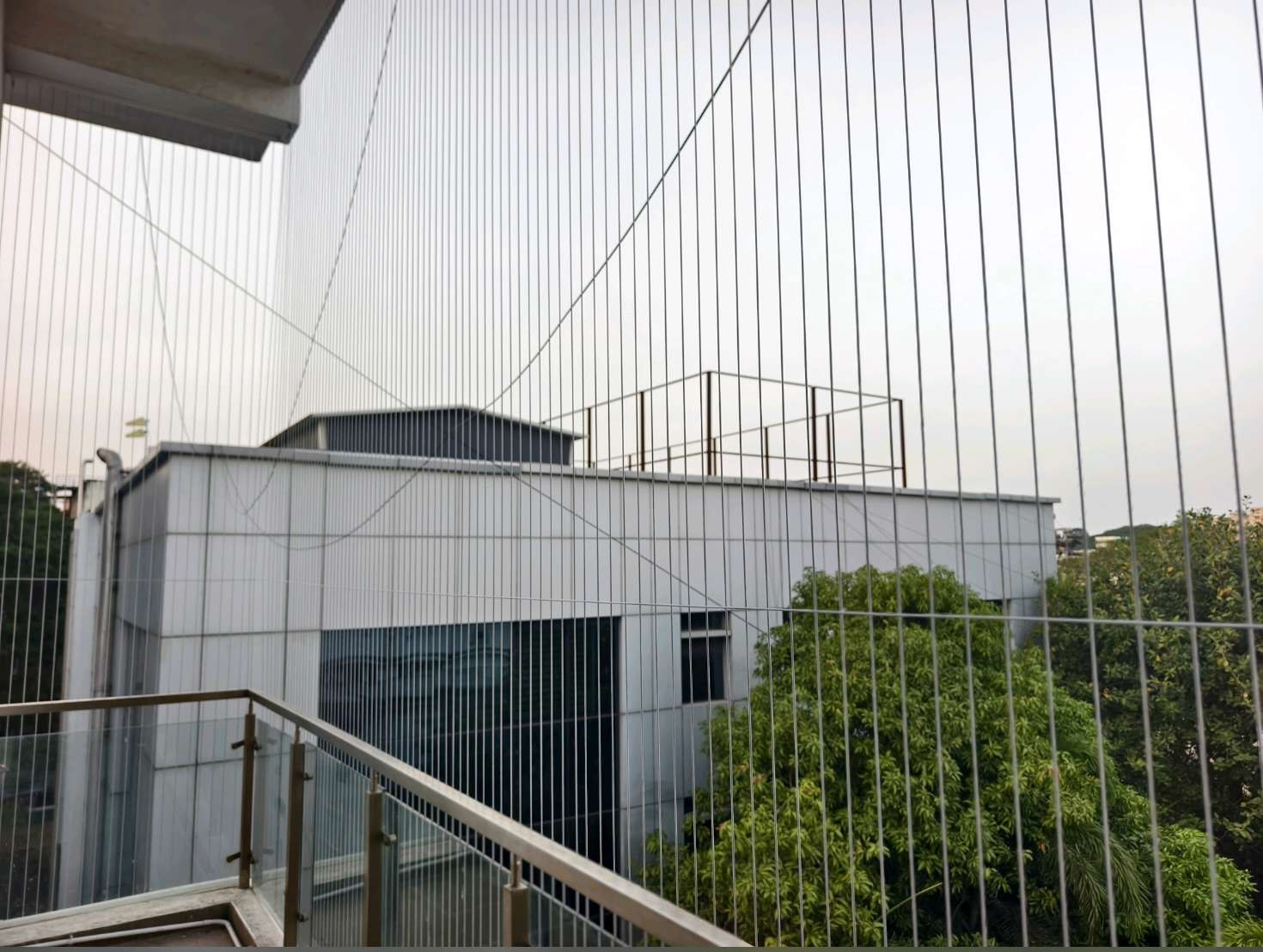 Balcony corner with closely spaced vertical cables — real YPL work shown for Keelkattalai customers