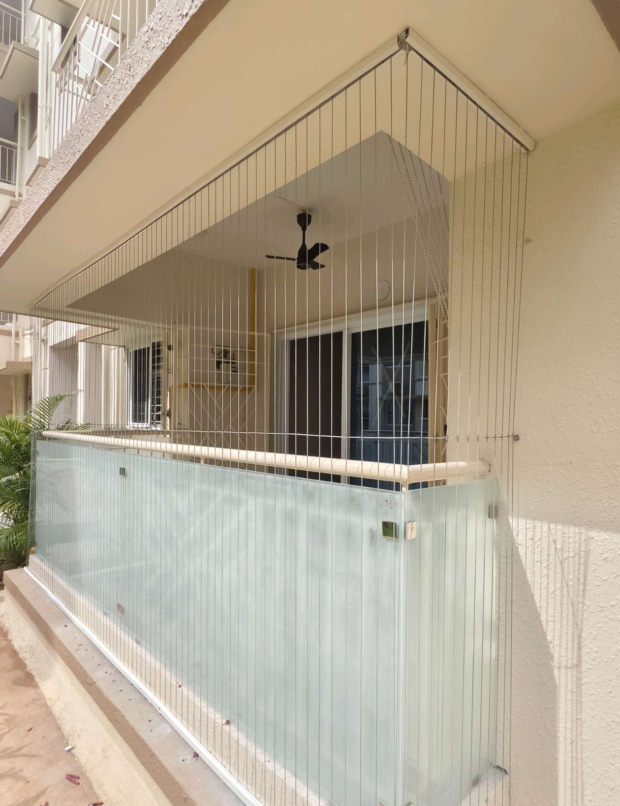 Long balcony with glass railing and cable protection — real YPL work shown for Kovur customers
