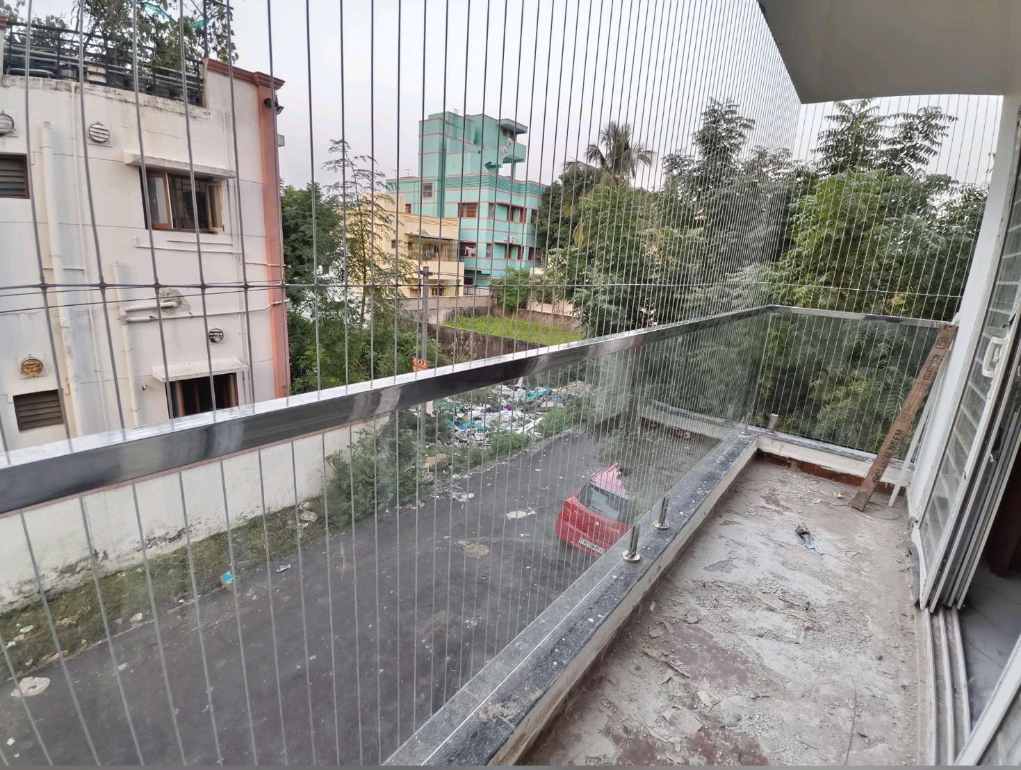 Long narrow balcony with a glass railing — real YPL work shown for Manali customers