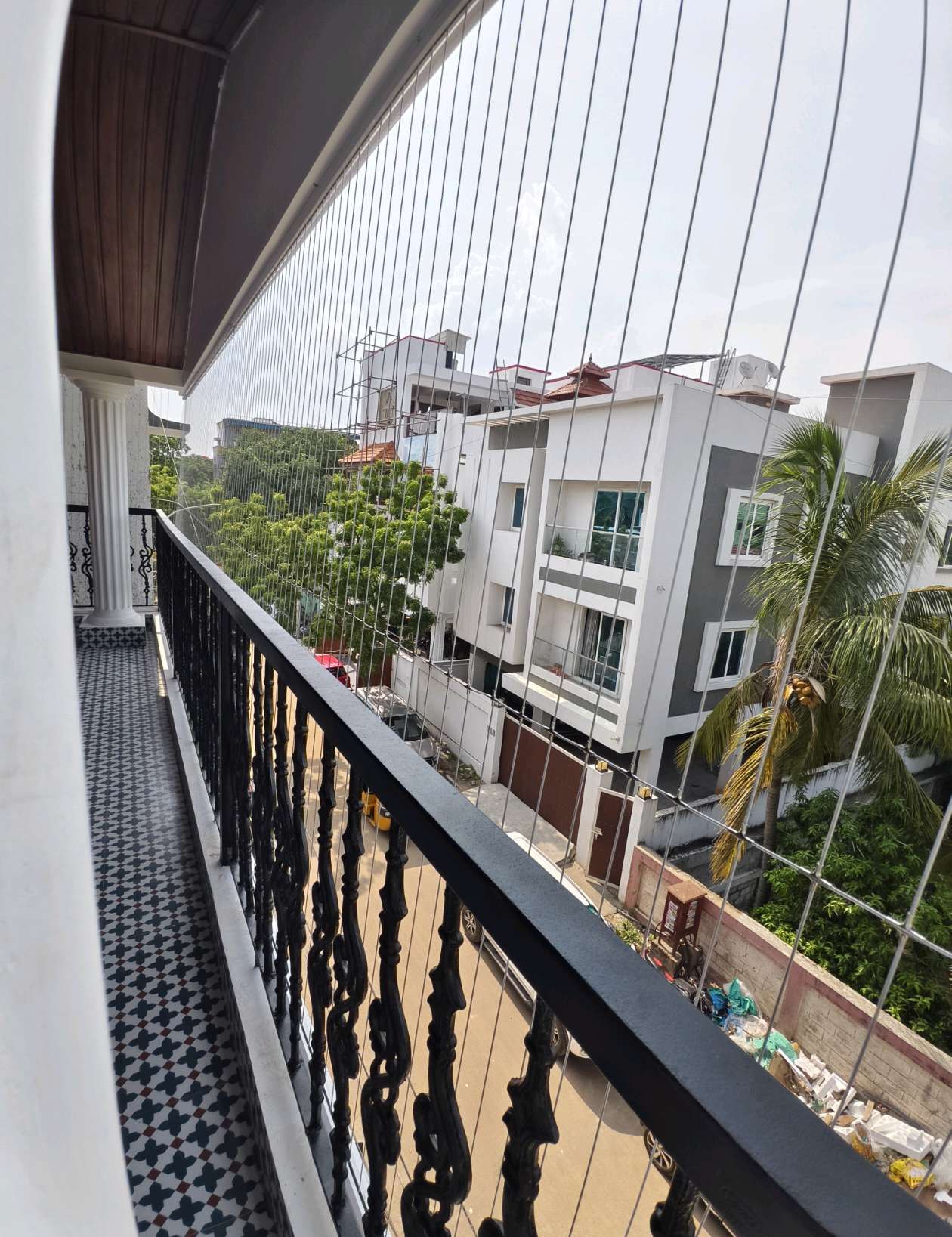 Balcony with grill cables and neighboring homes — real YPL work shown for Basin Bridge customers