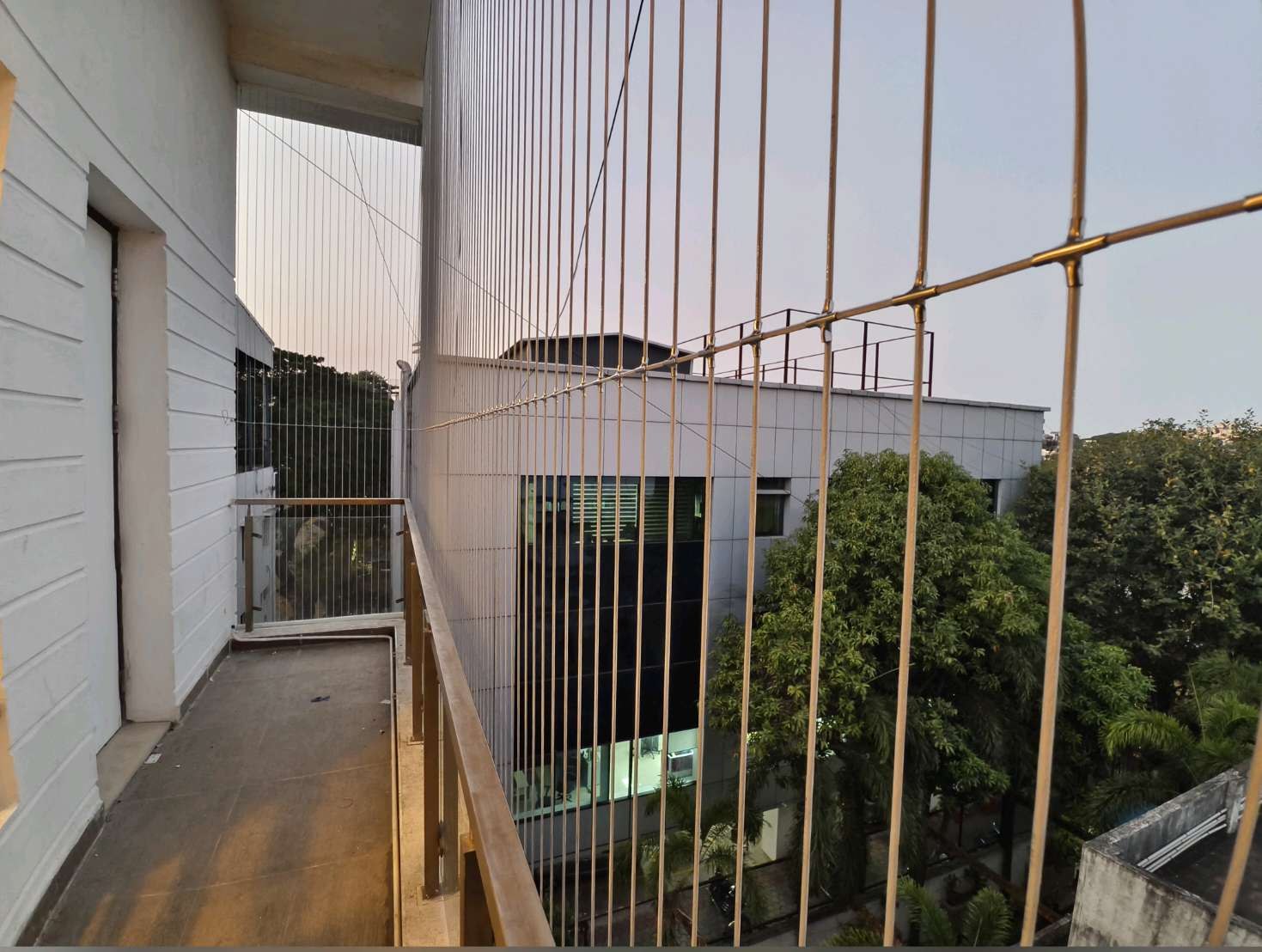 Close view of balcony cables and supporting railing — real YPL work shown for Perungalathur customers